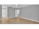 Bright bedroom with neutral walls, wood floors, and ceiling fan at 1102 Winter Springs Blvd, Winter Springs, FL 32708