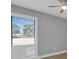 Bright bedroom with window and ceiling fan offers ample natural light and comfort at 1102 Winter Springs Blvd, Winter Springs, FL 32708
