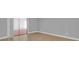 Bright bedroom with neutral walls, wood floors, and sliding closet doors at 1102 Winter Springs Blvd, Winter Springs, FL 32708