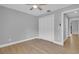 Neutral bedroom features wood floors, ceiling fan, and a closet at 1102 Winter Springs Blvd, Winter Springs, FL 32708
