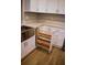 Custom pull out spice rack conveniently located next to sink with new quartz countertops and fixtures at 1102 Winter Springs Blvd, Winter Springs, FL 32708