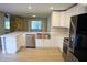 Modern kitchen with stainless steel appliances, custom cabinets, and quartz countertops at 1102 Winter Springs Blvd, Winter Springs, FL 32708