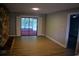 Spacious living room features light wood floors, stone fireplace and access to lanai via sliding doors at 1102 Winter Springs Blvd, Winter Springs, FL 32708