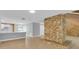 Inviting living room featuring a stone fireplace, new floors and an open concept design at 1102 Winter Springs Blvd, Winter Springs, FL 32708