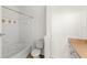 Bathroom with a tiled shower, vanity, and neutral color scheme at 12843 Madison Pointe # 208, Orlando, FL 32821