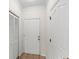 Inviting entryway features neutral tones and tile flooring, creating a clean and welcoming space at 12843 Madison Pointe # 208, Orlando, FL 32821