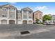 Modern townhome complex with attached garages and ample parking at 12843 Madison Pointe # 208, Orlando, FL 32821