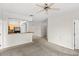 Bright living room featuring an open layout and a glimpse into the kitchen at 12843 Madison Pointe # 208, Orlando, FL 32821