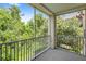 Enjoy the serene view from this screened porch with lush greenery at 12843 Madison Pointe # 208, Orlando, FL 32821