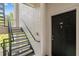A staircase leading to the unit, providing access to the upper levels of the building at 12843 Madison Pointe # 208, Orlando, FL 32821