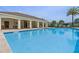 Inviting community pool with covered seating and ample space for relaxation and recreation at 14007 Picard Aly, Winter Garden, FL 34787
