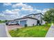 Well-maintained townhome exterior with attached garage and neatly manicured landscaping at 14007 Picard Aly, Winter Garden, FL 34787