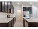 Modern kitchen featuring stainless steel appliances, a center island, and ample cabinet space at 14007 Picard Aly, Winter Garden, FL 34787