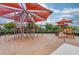 Community playground featuring slides, climbing structures, and shaded areas for children to enjoy at 14007 Picard Aly, Winter Garden, FL 34787