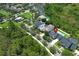 An aerial view of a lovely home in a verdant community, complete with a private pool and lush landscaping at 14252 Anastasia Ln, Orlando, FL 32828