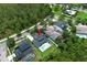 Aerial view of a home with a private pool and lush landscaping in a beautiful, green community at 14252 Anastasia Ln, Orlando, FL 32828