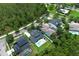 Aerial view of a home with a private pool and lush landscaping in a beautiful, green community at 14252 Anastasia Ln, Orlando, FL 32828
