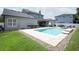 Spacious backyard featuring a swimming pool and an outdoor dining area at 14252 Anastasia Ln, Orlando, FL 32828