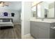 The primary bathroom features a granite countertop vanity and glass enclosed walk-in shower at 14252 Anastasia Ln, Orlando, FL 32828