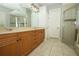 Bathroom with double sinks, stylish fixtures, and a separate shower at 14252 Anastasia Ln, Orlando, FL 32828