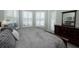 Comfortable bedroom featuring wood floors, plantation shutters and a spacious layout at 14252 Anastasia Ln, Orlando, FL 32828