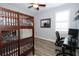 ' bedroom offers a desk and bunk beds at 14252 Anastasia Ln, Orlando, FL 32828