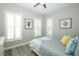 Charming bedroom with wood-look floors and plantation shutters at 14252 Anastasia Ln, Orlando, FL 32828