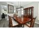 Open dining area features a display cabinet, and stylish floors at 14252 Anastasia Ln, Orlando, FL 32828