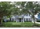 Charming two-story home with a well-manicured lawn, elegant landscaping, and inviting curb appeal at 14252 Anastasia Ln, Orlando, FL 32828