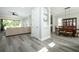 Open-concept living space featuring stylish floors seamlessly connecting living and dining areas at 14252 Anastasia Ln, Orlando, FL 32828