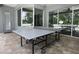 Covered outdoor patio with a ping pong table for entertainment at 14252 Anastasia Ln, Orlando, FL 32828