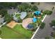 Overhead shot featuring the community playground, showcasing swing sets, play structures, picnic shelter and parking at 14252 Anastasia Ln, Orlando, FL 32828