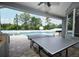 Outdoor area with swimming pool, and a summer kitchen for cooking at 14252 Anastasia Ln, Orlando, FL 32828