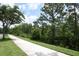 Scenic walking path surrounded by lush greenery, ideal for a refreshing outdoor walk or jog at 14252 Anastasia Ln, Orlando, FL 32828