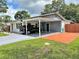 This home features a carport with extra parking space and a well-manicured lawn at 1428 Glendale St, Lakeland, FL 33803