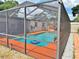Enjoy this screened pool area with comfortable seating and a well maintained patio at 1428 Glendale St, Lakeland, FL 33803