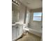 Bathroom featuring tiled floors, a toilet and vanity with sink at 1433 Bluff Loop, Dundee, FL 33838