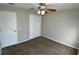 Bedroom featuring carpeted floors, closet, and ceiling fan with lighting at 1433 Bluff Loop, Dundee, FL 33838