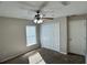 Bedroom with carpet flooring, a ceiling fan and a closet at 1433 Bluff Loop, Dundee, FL 33838