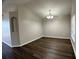 Dining room featuring stylish flooring and a chandelier at 1433 Bluff Loop, Dundee, FL 33838