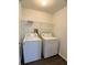 Laundry room featuring wood floors, washer and dryer, and wire shelf at 1433 Bluff Loop, Dundee, FL 33838