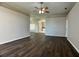 Open living room featuring stylish floors, ceiling fan, and neutral walls at 1433 Bluff Loop, Dundee, FL 33838
