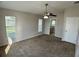 Main bedroom featuring carpet floors, neutral walls, and a ceiling fan at 1433 Bluff Loop, Dundee, FL 33838