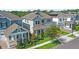 Aerial view of a neighborhood featuring various two-story homes, well-maintained lawns, and paved streets at 15343 Lebeau Loop, Winter Garden, FL 34787