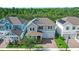 Charming two-story home featuring a brick driveway, two-car garage, manicured lawn, and lovely landscaping at 15343 Lebeau Loop, Winter Garden, FL 34787