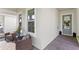 Inviting front porch with brick flooring and comfortable seating area with throw pillows and potted plants at 15343 Lebeau Loop, Winter Garden, FL 34787
