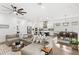 Open concept living room and kitchen with hardwood floors and lots of natural light at 15343 Lebeau Loop, Winter Garden, FL 34787