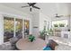 Covered patio with an outdoor kitchen, dining area, and a view of the pool at 15343 Lebeau Loop, Winter Garden, FL 34787