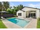 Beautiful pool area with ample seating and a lush, well-maintained yard at 1541 Chestnut Ave, Winter Park, FL 32789