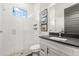 Modern bathroom featuring a glass-enclosed shower, sleek vanity, and stylish tile work at 1541 Chestnut Ave, Winter Park, FL 32789